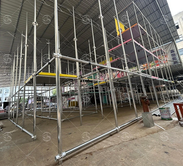 Galvanized steel structure framework of an indoor playground during the manufacturing and assembly process.