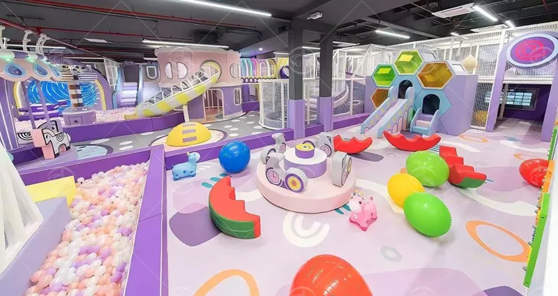 Colorful indoor soft play facility equipped with ball pit, slides and multi‑functional play units for family entertainment center